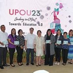 UP President Danilo Concepcion (fifth from left) and Chancellor Melinda Bandalaria (to his left) pose for photos with representatives of some of UPOU’s partner institutions. From left, with plaques: Tuntungin-Putho Integrated National High School; Quezon Power Limited Co.; HealthServ Los Baños Medical Center; CoopHub; Department of Science and Technology-Philippine Council for Industry, Energy and Emerging Technology Research and Development; Municipal Government of Mauban, Quezon; Veterans Bank; Land Bank of the Philippines; Los Baños Doctors Hospital and Medical Center, Inc.; and Digital Freedom Network (Photo by Misael Bacani, UP MPRO)