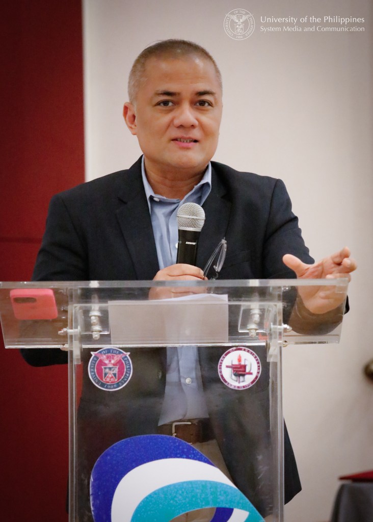 UP VPRI Joel Joseph Marciano delivers a message on behalf of UP President Angelo Jimenez. Photo by Misael Bacani, UPS-MCO.