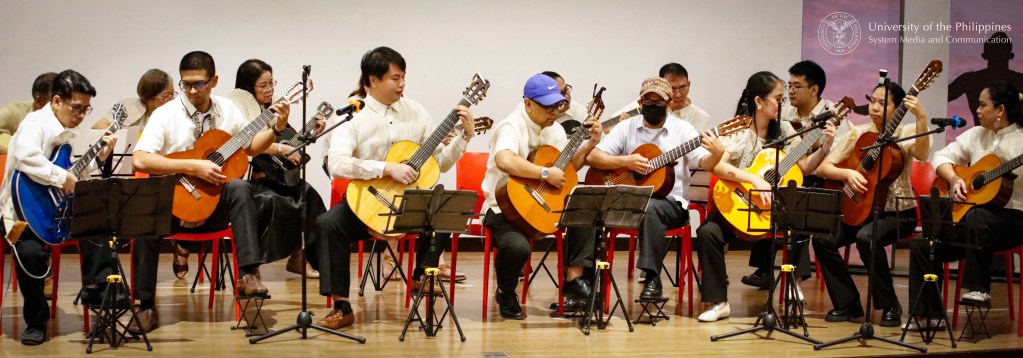 Participants of Gitara at Awit, the College of Music extension program, perform their rendition of Juan Karlos’ “Buwan.” Photo by Misael Bacani, UPS-MCO.