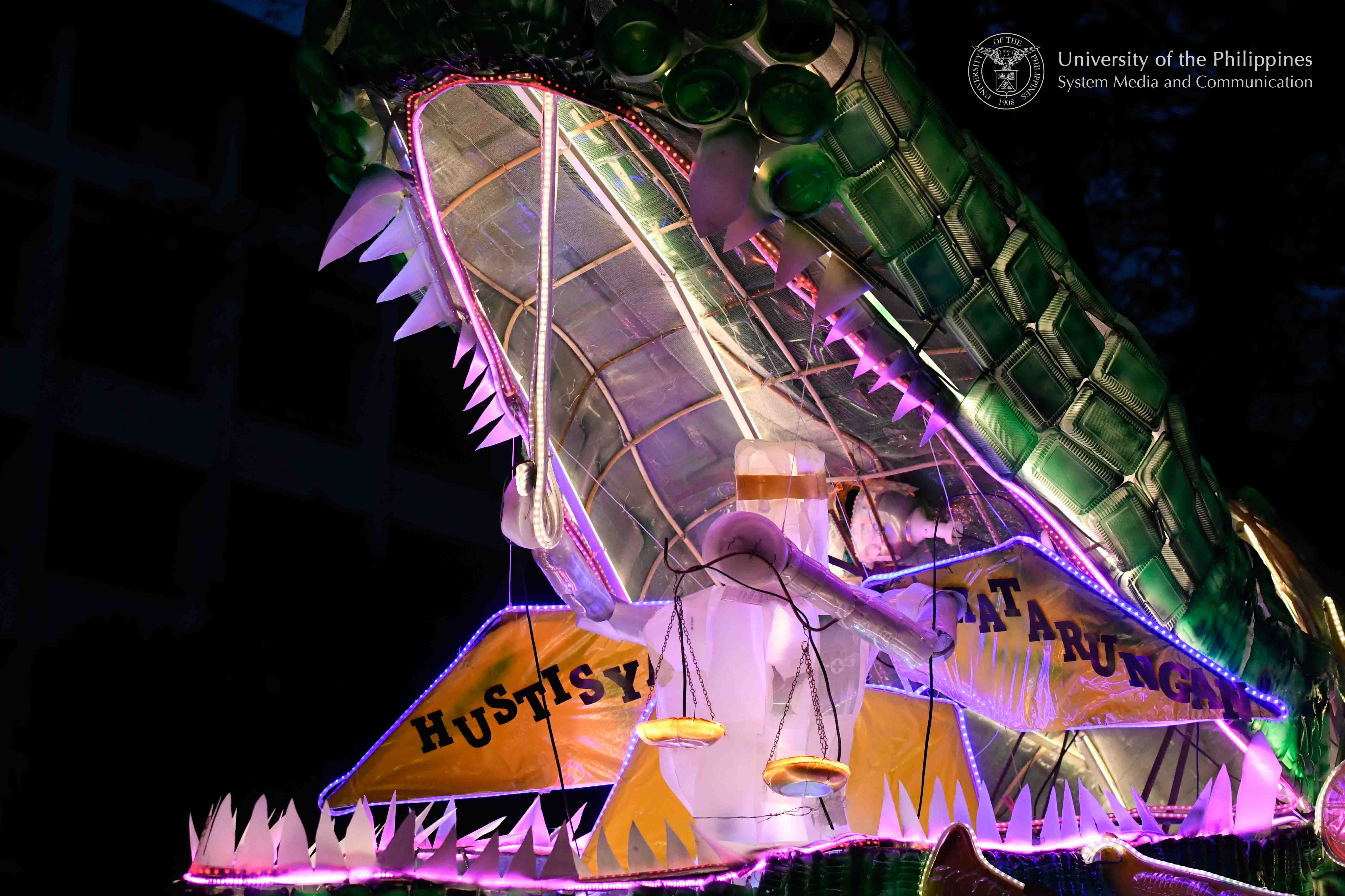The lantern float of the UP Diliman College of Law features Lady Justice being swallowed by a crocodile, which represents the injustices bred by corruption in government. Photo by Kevin Roque, UPS-MCO.