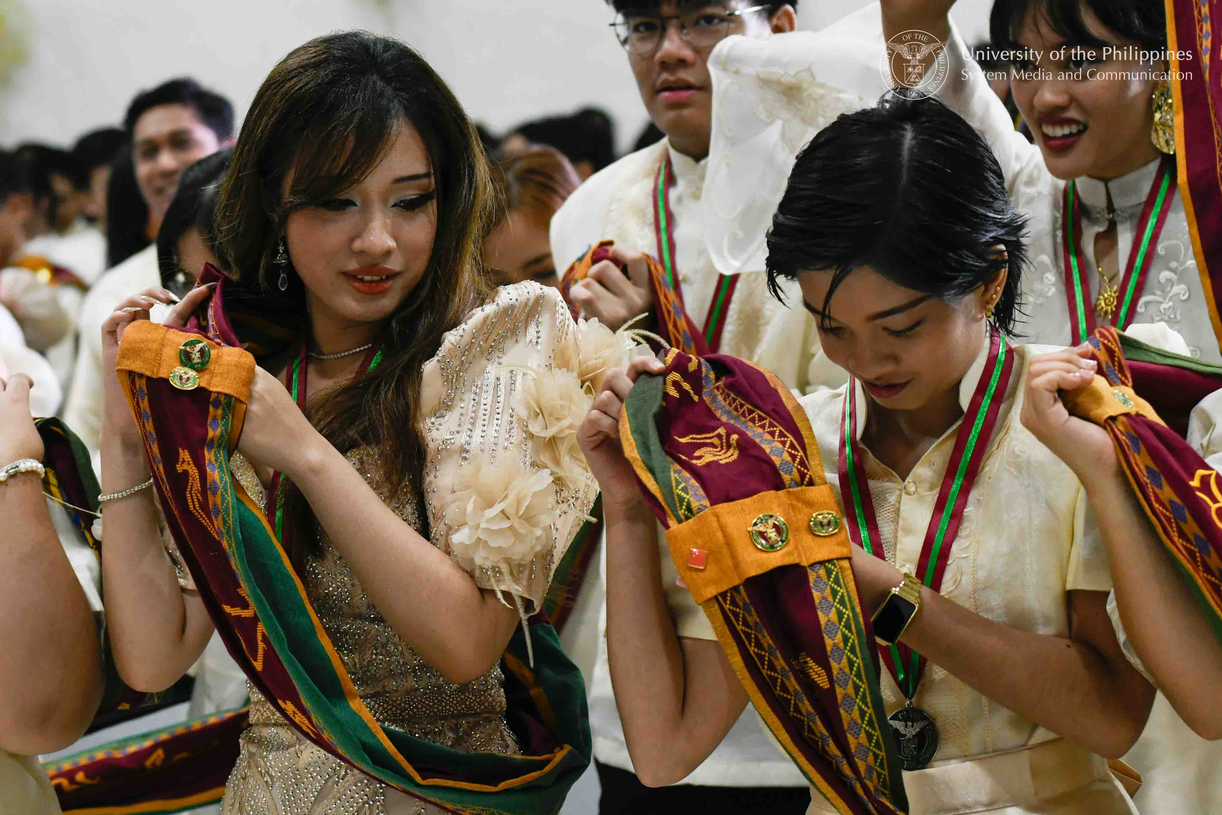 Graduates are all smiles as they shift their Sablay from their right shoulder to the left. Photo by Kevin Roque, UPS-MCO.